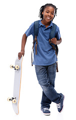 Image showing Portrait, skateboard and smile with african boy in studio isolated on white background for sports or leisure. Kids, happy or training and confident young skater kid with board for fun or recreation