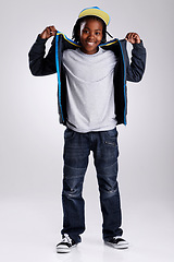 Image showing Boy, child and fashion with streetwear in portrait, casual outfit with smile for positivity isolated on white background. Hip hop, trendy style and African kid in studio, youth with tshirt and jeans