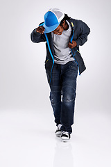 Image showing Child, smile and dancing with hiphop and street style clothing in a studio with boy dancer. Trendy, energy and cool African kid with youth and rap music with white background and gen z clothes