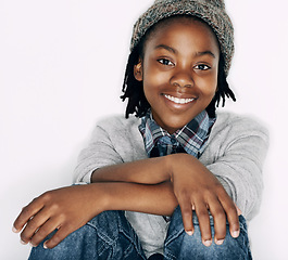 Image showing Boy, fashion and portrait with gen z, trendy and cool style with a smile in a studio. Child, happy and African male kid from Chicago with confidence and modern youth outfit with white background