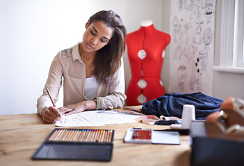 Image showing Fashion designer, woman and sketch on paper with pencil in startup office of small business. Creative, person or tailor drawing at desk for textile project, planning or writing draft for clothes