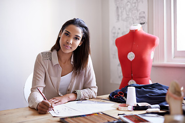 Image showing Fashion designer, portrait and business woman drawing on paper with pencil in startup office. Creative, person and face of tailor sketch at desk, professional or employee working on project in Brazil