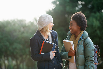 Image showing Education, books and conversation with woman friends outdoor on campus together for learning or development. College, school or university with young student and best friend talking at recess break