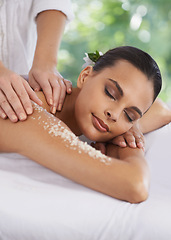 Image showing Woman, massage and body scrub in spa, detox and cosmetic sugar treatment for skin care in salon. Person, relax or cosmetology by masseuse for dead cells, calm or wellness with healing hands on bed