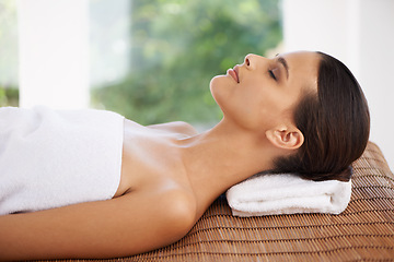 Image showing Woman, wellness and relax in spa on bed, sleeping and beauty of body care and pamper treatment. Person, rest and peace with health in salon, zen and natural skincare on travel at holiday resort