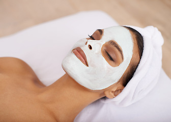 Image showing Woman, clay mask and facial for skincare in spa, detox and cosmetic treatment for beauty or health. Person, relax or dermatology with natural cleaning on skin, soothing or zen with wellness in salon