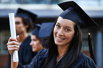 Image showing Woman, student and portrait at graduation, scroll and university success or achievement. Female person, smile and pride at outdoor ceremony, higher education and degree or diploma for credential