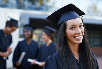 Image showing Woman, student and portrait at graduation, milestone and university success or achievement. Happy female person, smile and pride at outdoor ceremony, higher education and knowledge in qualification