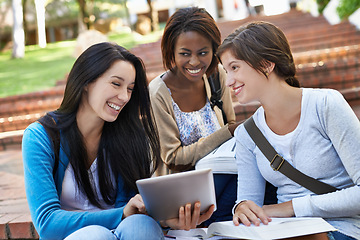 Image showing University, students and women with a tablet, outdoor and sunshine with smile and teamwork with online research. People, academy and girls on break and tech for a project, digital app and cooperation