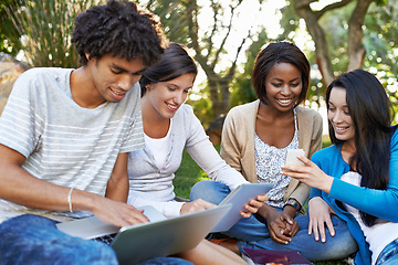 Image showing Happy group, student and technology at park for collaboration, networking or communication. Young people or academic learners with smile on laptop, tablet and phone for online learning or education