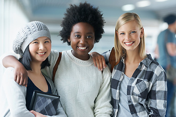 Image showing Students, women and portrait in hallway at college with books for education, learning and knowledge. University, face and friends with smile for break, relax or diversity with scholarship in corridor