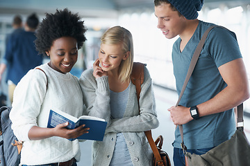 Image showing Students, friends and reading in hallway at college with books for education, learning or knowledge. University, scholar or people with smile for break, relax or diversity for scholarship in corridor