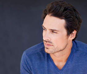 Image showing Serious, thinking and man in studio on dark background with ideas for future or remember history. Planning, decision and person with doubt, question a memory or consider a solution to problem solving