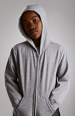 Image showing Fashion, portrait and teenager in hoodie at studio with serious kid in streetwear on grey background. African, child and cool boy with casual style, clothes and comfortable with outfit in mockup