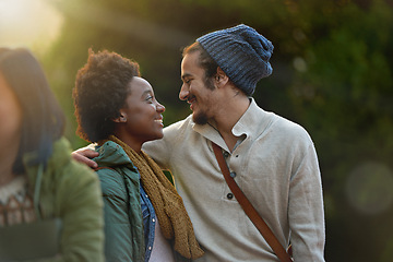 Image showing Love, park and happy interracial couple together with hug, bag or morning commute to university with smile. College, students and romance in nature, man and woman with diversity, sunshine and embrace