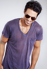 Image showing Happy, man and fashion with sunglasses in studio with confidence in clothes, cool style and pride. Summer, holiday and person smile in casual outfit for vacation, break and relax on white background