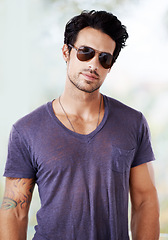 Image showing Fashion, sunglasses and portrait of man outdoor with confidence, cool style and pride. Summer, holiday and person with serious face in casual outfit for vacation in Miami and relax in Florida