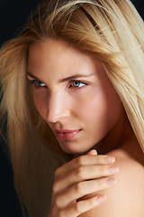 Image showing Hair care, wind and beauty of woman, thinking and skincare isolated on a black studio background. Hairstyle, makeup and blonde model in breeze, hairdresser and salon for facial treatment cosmetics