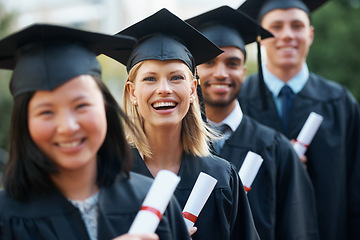 Image showing College, graduation and portrait of group at ceremony with diploma, certificate and happiness in line. University, success and class of people with achievement of degree in education on scholarship