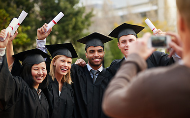 Image showing Graduation, success and photograph of student friends outdoor on campus at university or college. Education, certificate and achievement with group of young graduate people together for picture