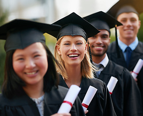 Image showing Portrait, graduation and woman in line with students at college or university for ceremony of achievement. Education, certificate and scholarship with group of happy young friends outdoor on campus