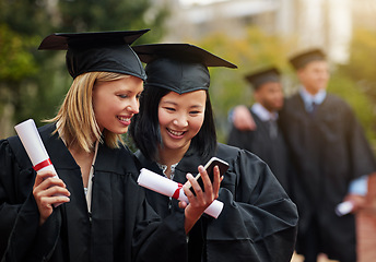 Image showing Graduation, certificate and phone with student friends outdoor on campus for university or college event. Mobile, communication and smile with young graduate women at school for higher education