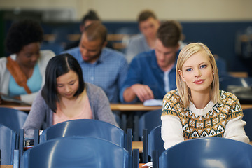 Image showing University, students and portrait in course lecture and learning in classroom for education. College, campus and people studying for test in academy and reading project, research or knowledge