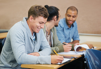 Image showing Students, university and man writing test in classroom, information and notes for studying. People, books and knowledge in education for learning, problem solving and ideas for solution in assessment