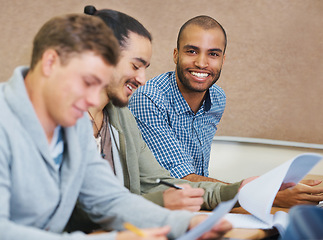 Image showing Student, college and man in classroom portrait, information and notes for studying. People, assignment and knowledge in education for learning, problem solving and ideas for solution in assessment