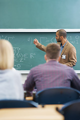 Image showing Board, lecture and professor with students in classroom for mathematics lesson at university campus. Education, learning and college teacher explaining work or teaching for assignment, test or exam.