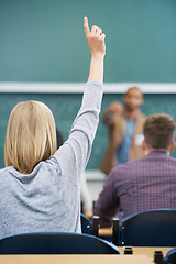 Image showing Student, hand up and question teacher at lecture for learning development or university, scholarship or behind. Person, finger and professor at chalk board in classroom or lesson, knowledge or Canada