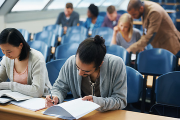 Image showing Students, university and writing exam in classroom, information and notes for studying. People, books and knowledge in education for learning, problem solving and ideas for solution in assessment