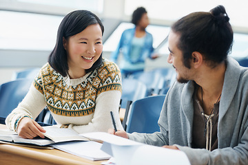 Image showing Conversation, university and students in classroom for studying with textbook for test or exam. Discussion, writing and young people working on college assignment together in lecture hall at academy