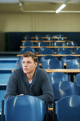 Image showing Thinking, university and man student in classroom brainstorming for exam studying ideas. Planning, education and young male person in lecture hall with question for college assignment at academy.