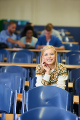 Image showing University, student and happy in lecture, class and learning in hall for education. College, campus and people studying for course in school and writing notes for project, research or knowledge