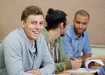 Image showing Student, university and man in classroom portrait, information and notes for studying. People, books and knowledge in education for learning, problem solving and ideas for solution in assessment