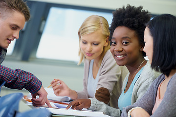 Image showing Students, teamwork and paperwork for group project in university for collaboration, assessment or education. Friends, face and diversity with smile on London campus or planning, proposal or knowledge