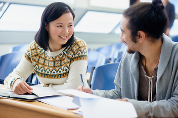 Image showing Conversation, college and students in classroom for studying with text book for test or exam. Discussion, writing and young people working on university assignment together in lecture hall at academy