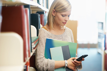 Image showing Woman, books in library and smartphone, education and research on university website for studying and knowledge. Student on campus, using phone for email or ebook, information and reading online