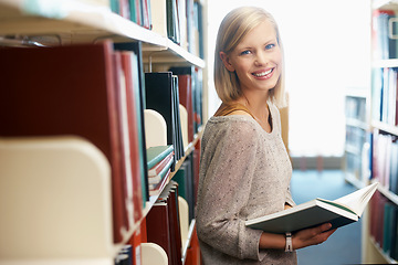 Image showing Woman, portrait and book in library for reading as student for university education, scholarship or knowledge. Female person, face and research for revision or Canada for lesson test, exam or degree