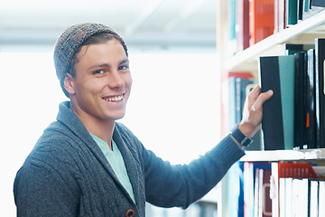 Image showing Man, portrait and book choice in library for university education or knowledge research, textbook or literature. Male person, student and smile or face in Canada for learning, exam or scholarship