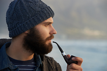 Image showing View, man and smoking a pipe in nature, thinking and tobacco habit on winter morning for creative idea. English guy, nicotine and vintage smoker for planning, satisfaction and vacation in cape town