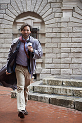 Image showing Happy, media and man in city, news reporter and journalist in New York and employee with feedback. Person, smile and guy with a microphone, review or reporting for television and broadcasting career