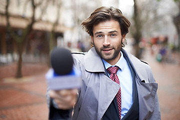 Image showing Microphone, city and interview with man, reporting and live streaming with broadcast and journalism. Portrait, person and employee with questions and feedback with breaking news and mic with opinion