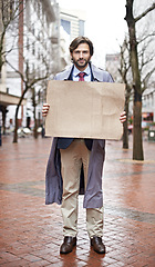 Image showing Recession, business and man with cardboard, unemployed in city and professional with stress or poverty. Person, outdoor or financial criss with worker or stock market crash with job loss with mockup