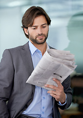 Image showing Business man, accountant and reading newspaper for information, article and story update. Male person, professional and stock market announcement for analyst, workplace and knowledge on trading