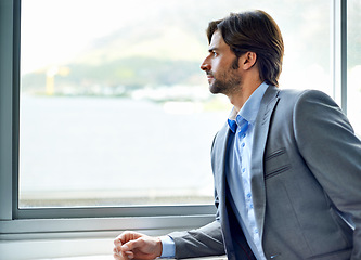 Image showing Business man, thinking and planning by window in office, wondering and contemplating real estate opportunity. Male person, view and ideas for future at company, employee and vision for development