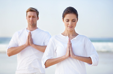 Image showing Couple, yoga and meditation on beach, prayer for zen and wellness, travel and mindfulness with holistic healing. People outdoor, exercise and peace, workout together for bonding with sea and nature