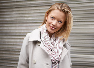 Image showing Woman, smile and portrait in city, winter and trendy style with scarf, fashion and commute on metro road. Girl, person and happy with edgy clothes for journey on urban sidewalk by street in Cape Town