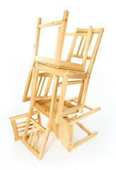 Image showing Stacked wooden chairs